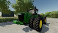 In-game view of John Deere 9R Series 4WD tractor