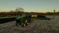 In-game view of John Deere 9RX Series 4WD tracked tractor planting the cotton using the 1775NT planter