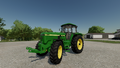 In-game view of John Deere 4755 row-crop tractor