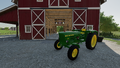 In-game view of John Deere 710 2WD tractor