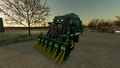 In-game view of John Deere CP690 cotton harvester