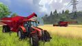 Case IH Axial-Flow 9230 harvesting the wheat field on the background