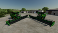 In-game view of John Deere X9 1100 combine harvester with two headers attached: with HD45X cutter (left) and HD50F cutter (right)
