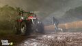 Farmer running back to Massey Ferguson MF 9S tractor due to rain