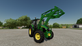 In-game view of John Deere 6M Series utility tractor with 603R front loader attached