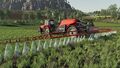 Case IH 7200 Pro Series spraying a field with a Kverneland iXtrack T4